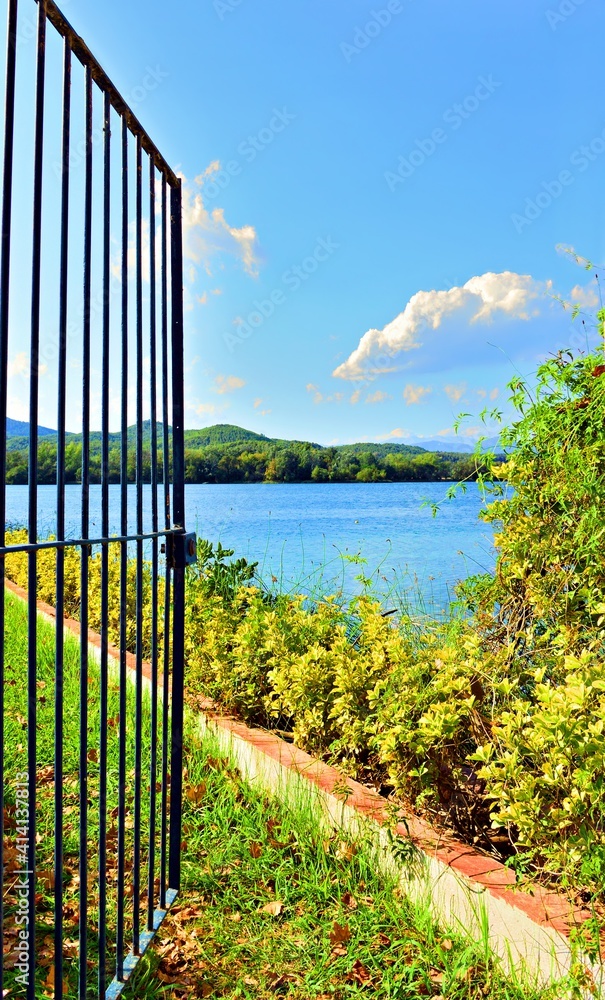 Fototapeta premium Open gate overlooking Lake Banyoles in the province of Girona, Catalonia, Spain