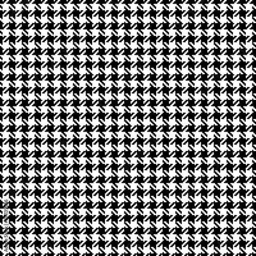 Houndstooth pattern in black and white. Textured seamless check plaid abstract art background for dress, coat, jacket, scarf, other modern spring autumn winter fashion fabric design.