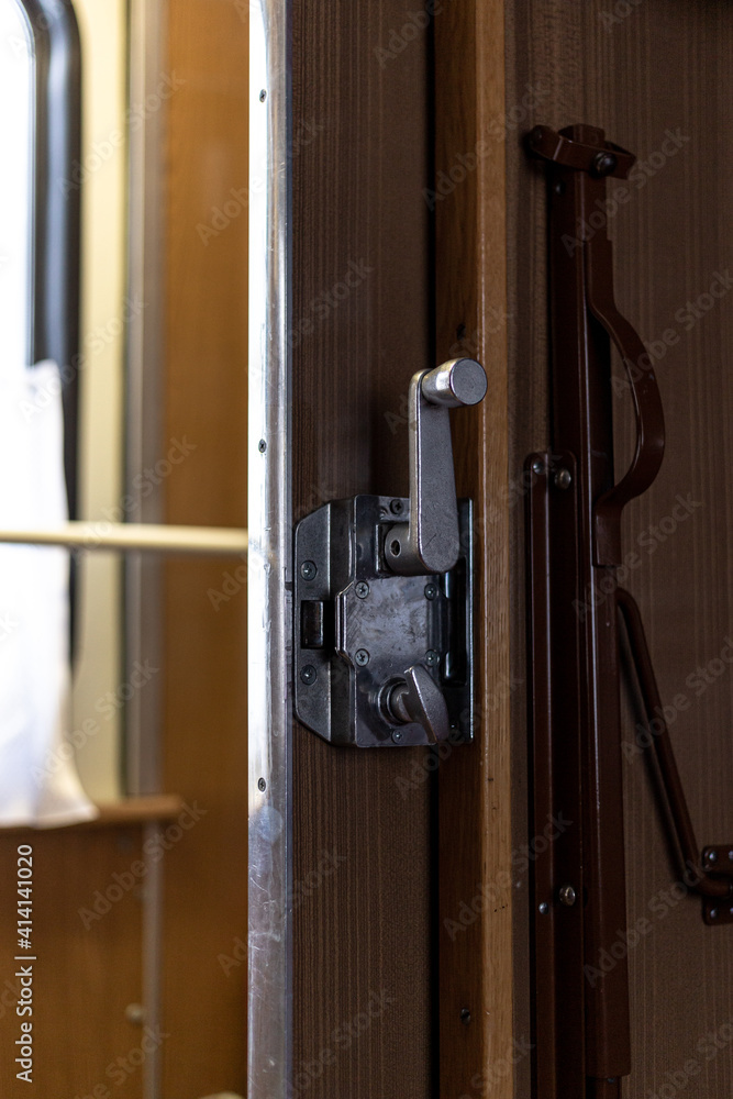 Door and doorknob in a train compartment