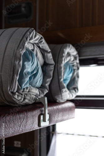 Mattress and pillow folded in the train carriage