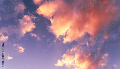 Natural sky background. Bright sunset with orange clouds.