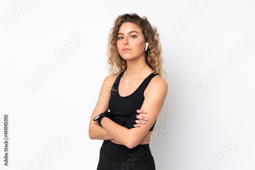 Young sport woman isolated on white background keeping the arms crossed