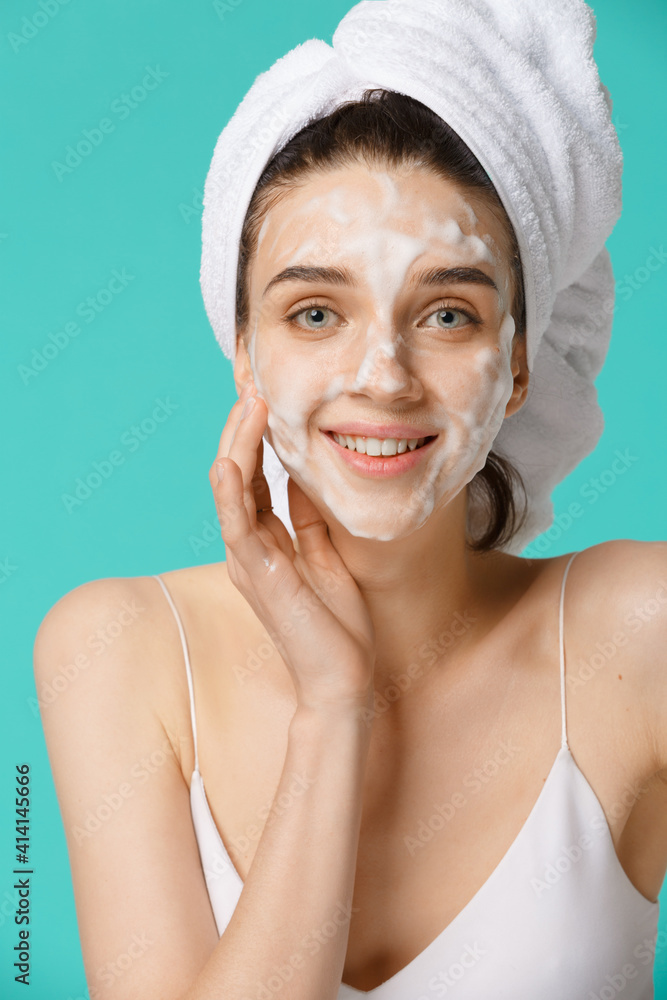 Beauty treatment - woman applying facial cleaning foam Beauty treatment - woman applying facial cleaning foam