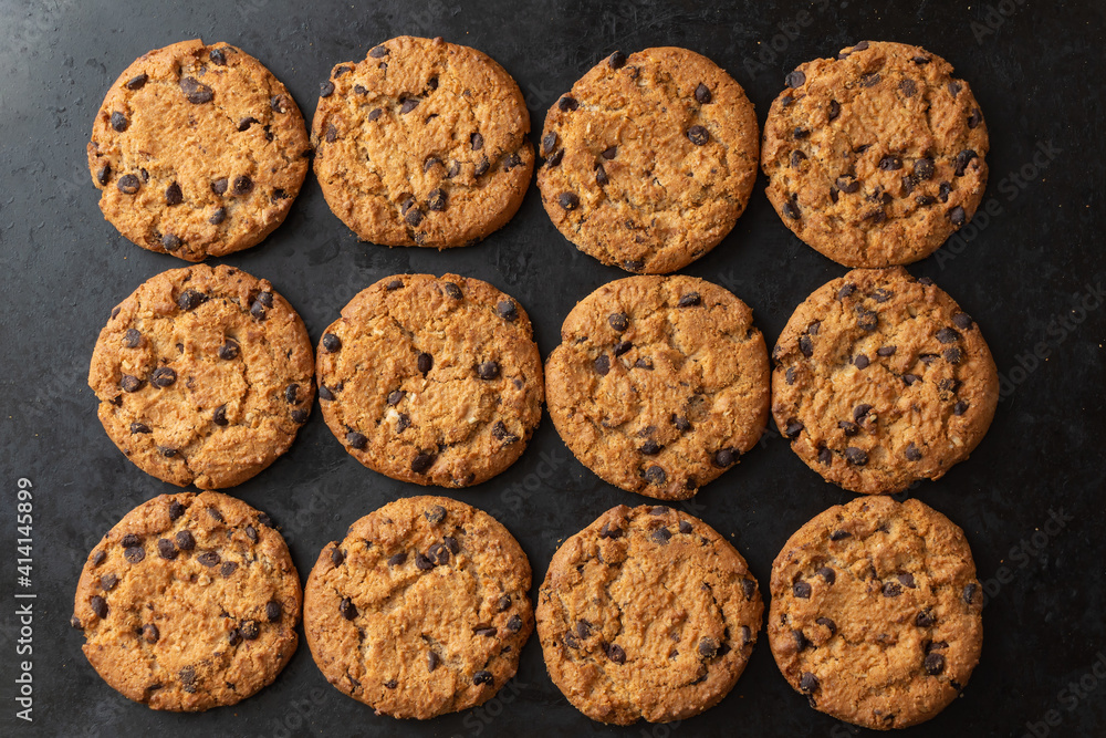 Oatmeal cookies with chocolate on black backround Oatmeal cookies with chocolate on black backround