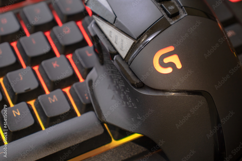 Logitech g502 hero gaming mouse on red illuminated gaming keyboard, close  up shot. devices to play on the pc. Verona, 08-02-21 Stock Photo | Adobe  Stock