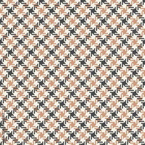Hounds tooth pattern spring autumn in grey and beige. Seamless textured decorative dog tooth tweed graphic art background for dress, jacket, skirt, other modern everyday casual fashion textile design.