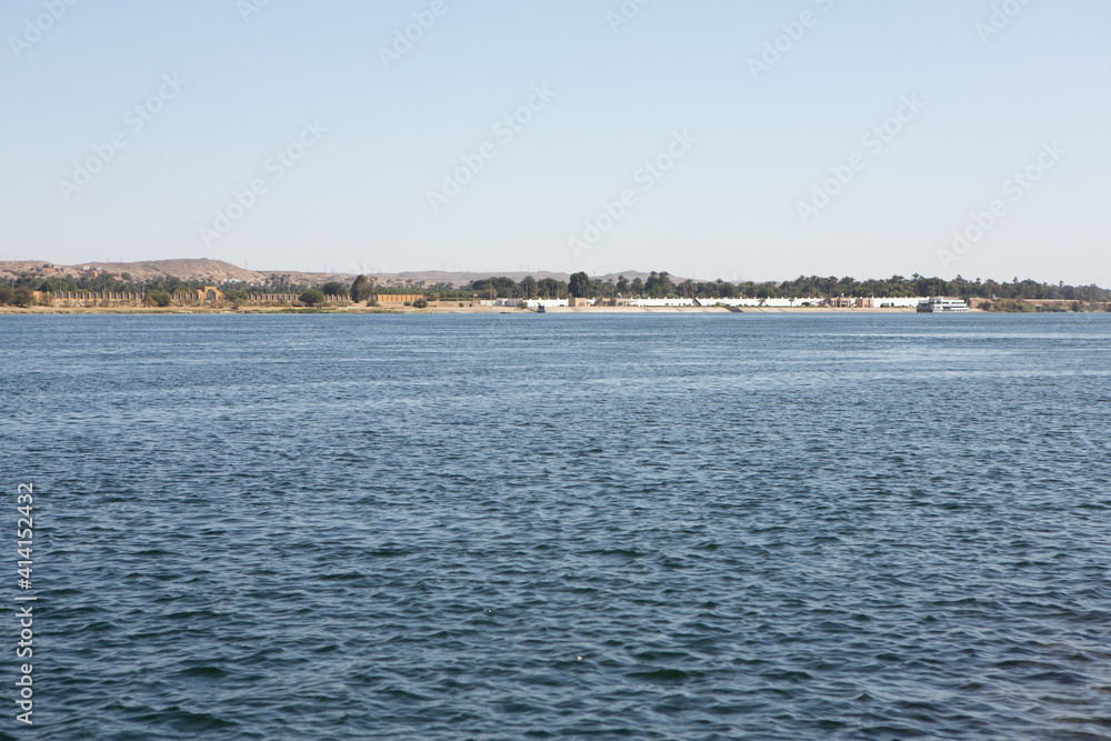 Nile the longest river in Africa. Primary water source of Egypt. Landscape with clear water river. Nile the longest river in Africa. Primary water source of Egypt. Landscape with clear water river.