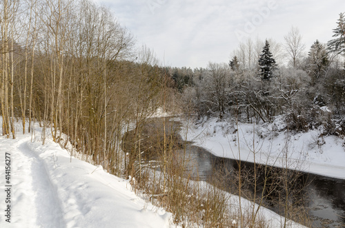 river flowing about the winter forest. photo