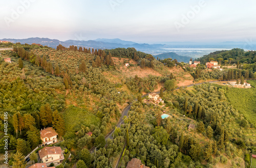 Landscape with Tuscan village Mommio Castello, at the top of the hill of Versilia, province of Lucca, Italy photo