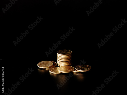 Wallpaper Mural stacks of gold coin on black background concept saving money Torontodigital.ca