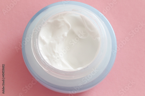 face cream on pink background