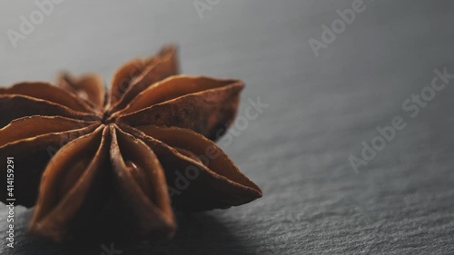 Dried whole anise star spice on black background photo