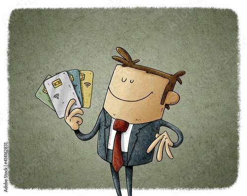 happy businessman holds some chip credit cards in his hand