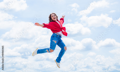 free your imagination. kid beauty and fashion. child jump in casual style. Child jumping on background of sky. summer holiday concept. childhood happiness. happy childrens day