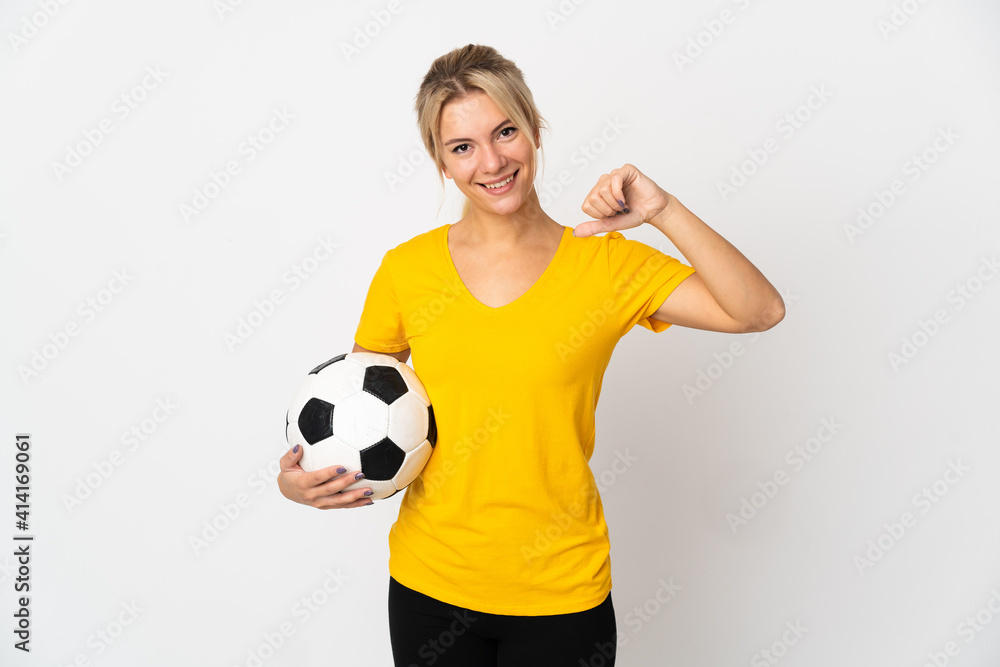 Young Russian woman isolated on white background with soccer ball and proud of himself
