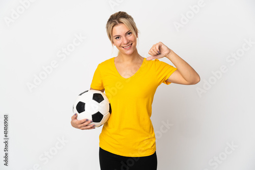 Young Russian woman isolated on white background with soccer ball and proud of himself © luismolinero