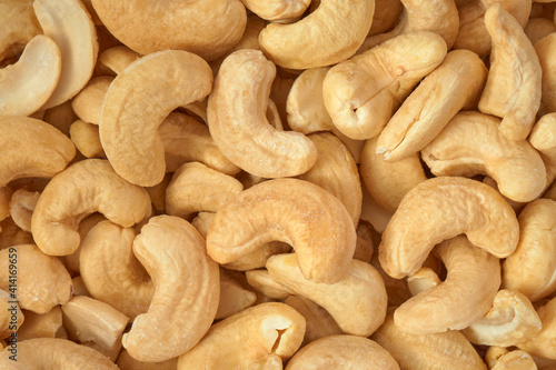 Cashew nuts closeup background, top view               