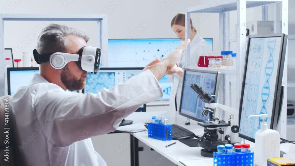 Professional team of scientists is working on a vaccine in a modern scientific research laboratory. Genetic engineer workplace. Future technology and science. Professional team of scientists is working on a vaccine in a modern scientific research laboratory. Genetic engineer workplace. Future technology and science.