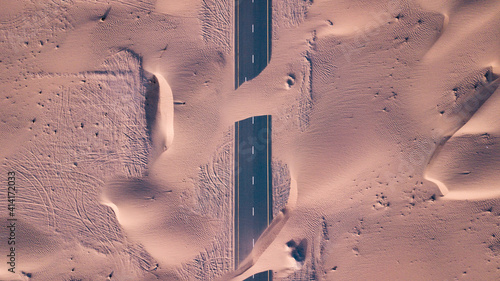 Canvas Print Aerial top view of roads through sand dunes in Dubai, UAE