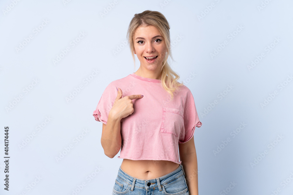 Blonde woman over isolated blue background with surprise facial expression Blonde woman over isolated blue background with surprise facial expression