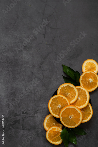 Sliced oranges on vintage golden plate © 682A_IA