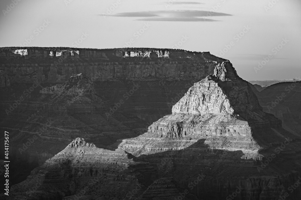 Sunset at the Grand Canyon in Arizona bathed in evening light in black and white