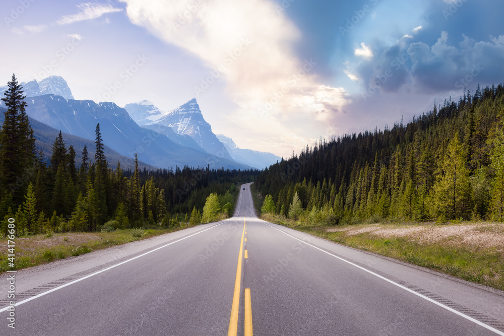 Fototapeta premium Scenic road in the Canadian Rockies. Colorful Sunset Sky Art Render. Taken in Icefields Parkway, Banff National Park, Alberta, Canada. Panorama Background