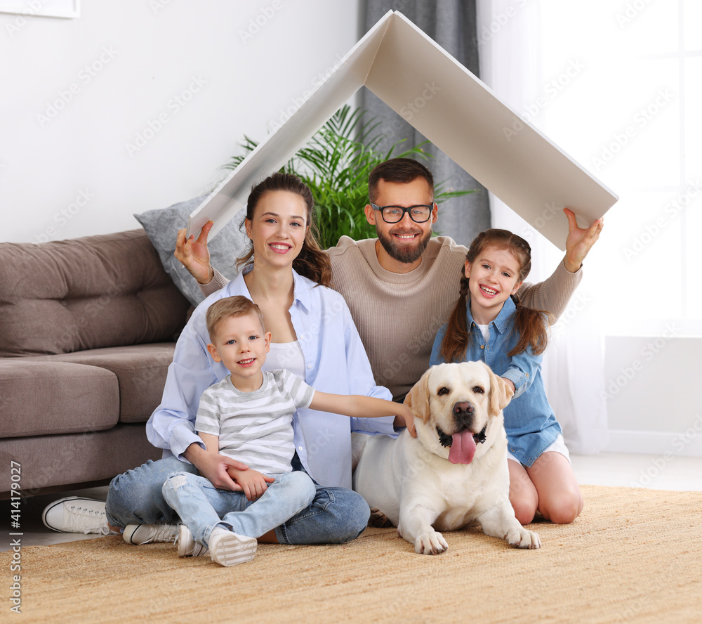 Fototapeta premium Happy family with dog enjoying new home
