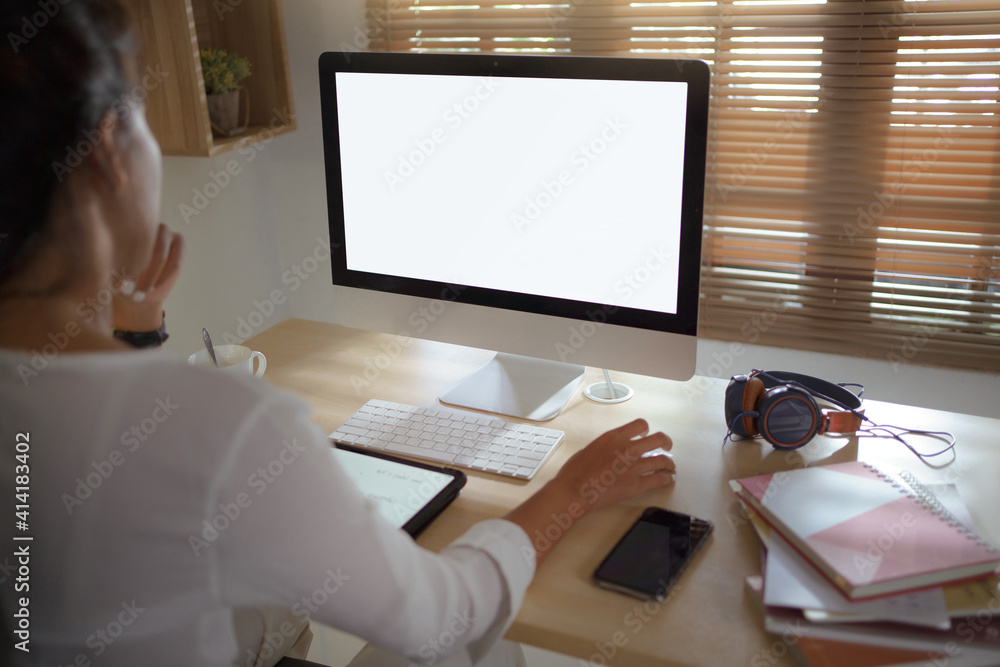 Asian woman She works at the home desk. White open space in the screen Asian woman She works at the home desk. White open space in the screen