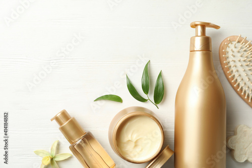 Εκτύπωση καμβά Flat lay composition with hair cosmetic products on white wooden table