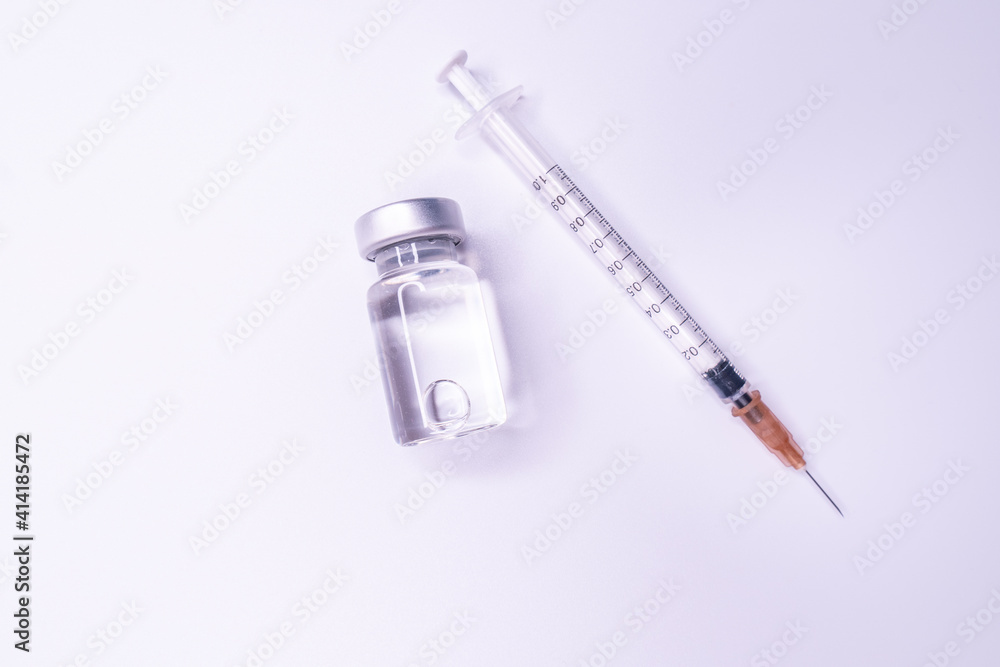 Medicine bottle for injection. Medical glass vials and syringe for vaccination. liquid drug or vaccine for treatment, flu in laboratory, hospital or pharmacy concept isolated on white background. Medicine bottle for injection. Medical glass vials and syringe for vaccination. liquid drug or vaccine for treatment, flu in laboratory, hospital or pharmacy concept isolated on white background.