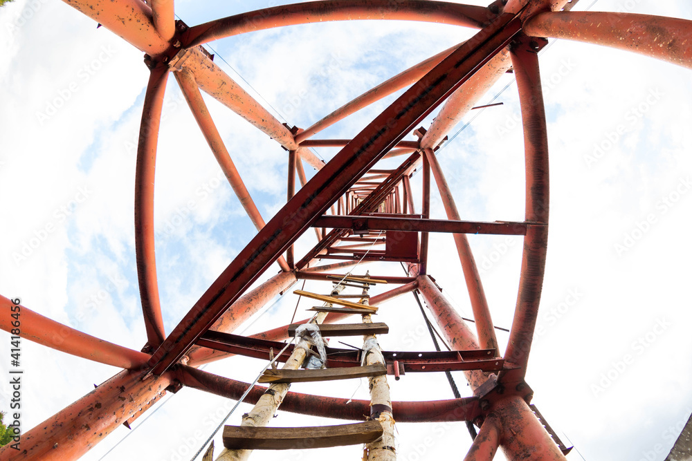 metal pipe with wooden ladder