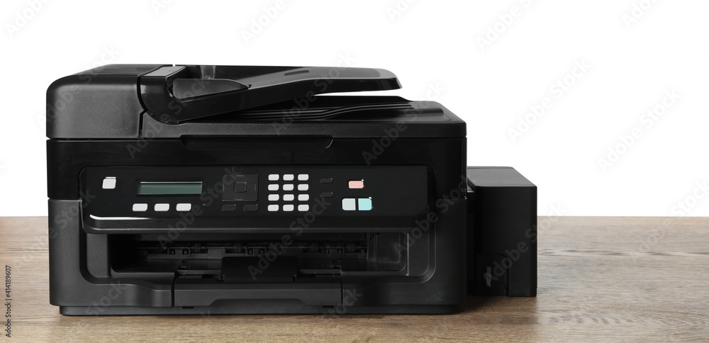 New modern multifunction printer on wooden table New modern multifunction printer on wooden table