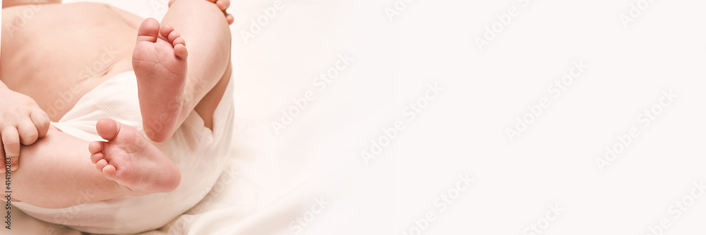 Little child feet. Toddler legs. Kid boxer panty. Baby person. Tiny health care. White children underware. Massage concept. Male person. Horizontal banner Little child feet. Toddler legs. Kid boxer panty. Baby person. Tiny health care. White children underware. Massage concept. Male person. Horizontal banner