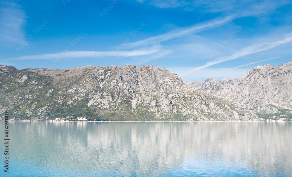 View of Bay of Kotor from the sea surrounded by mountains in Montenegro, one of the most beautiful bay in the world