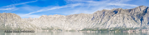 Panoramic view of Bay of Kotor from the sea surrounded by mountains in Montenegro, one of the most beautiful bay in the world
