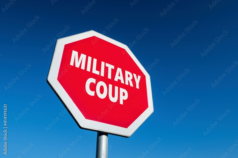 Stop sign with MILITARY COUP text to cease army putsch in country Stop sign with MILITARY COUP text to cease army putsch in country