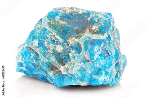 Macro shoot of piece of raw uncut Blue Apatite Mineral stone isolated on white background. Closeup photo of amazing natural turquoise specimen mineral rough. photo