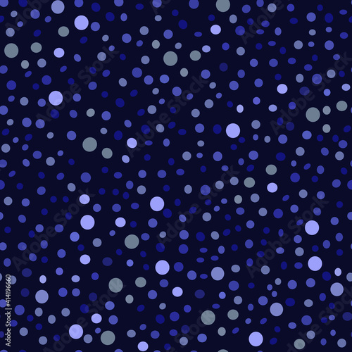 seamless pattern in the form of drops of various sizes and colors on a dark blue background