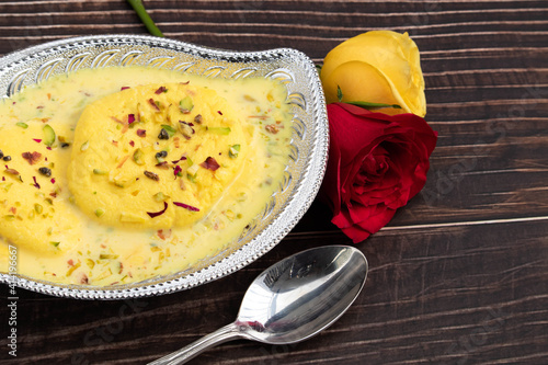 Delicious Bengali Mithai Rasmalai Also Known As Rossomalai Rasamalei Ras Malai Roshmolai Made Of Fresh Curdled Milk Pista Meetha Doodh And Kesar. Soaked In Milk Cream And Served In Silver Bowl photo