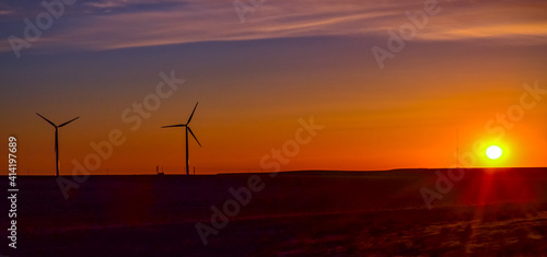 Wind turbines at sunset in the state of Idaho, Scenic view of wind turbines power generator