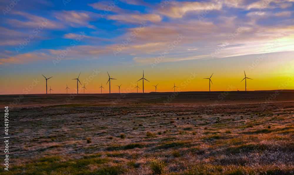 Wind turbines at sunset in the state of Idaho, Scenic view of wind turbines power generator