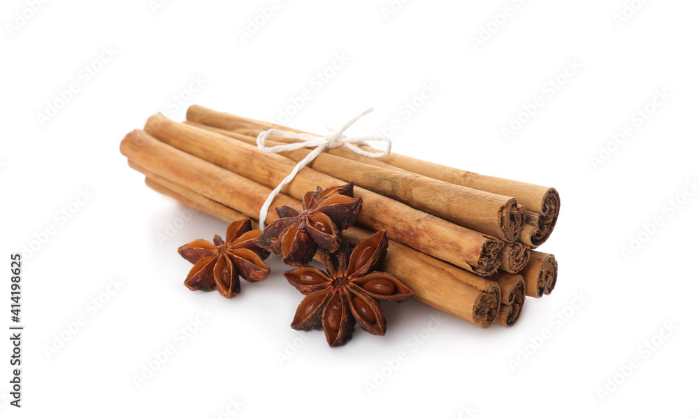 Aromatic cinnamon sticks and anise isolated on white Aromatic cinnamon sticks and anise isolated on white