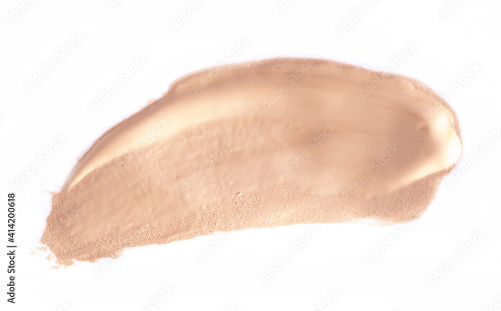 Foundation smear on a white background. A speck of makeup isolated. Foundation smear on a white background. A speck of makeup isolated.