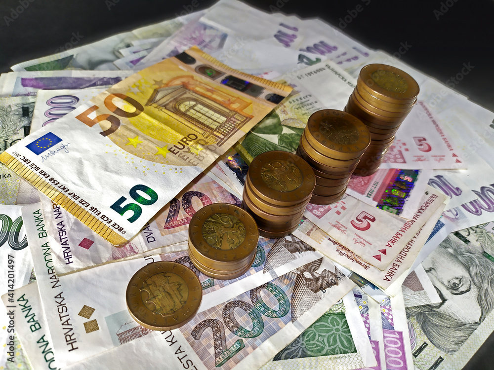 Closeup of Czech coins placed on different euro banknotes in different columns, Czech, Euro, Croatia, photo Closeup of Czech coins placed on different euro banknotes in different columns, Czech, Euro, Croatia, photo