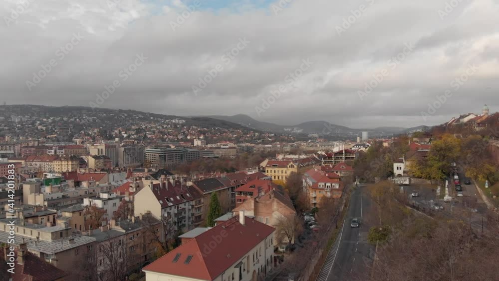 Drone view of the city of Budapest. Sights of the Hungarian capital. View of the Danube and Pest from a drone. Panoramic view of the city. Mountain view in Budapest.Cars drive on the roads of Budapest Drone view of the city of Budapest. Sights of the Hungarian capital. View of the Danube and Pest from a drone. Panoramic view of the city. Mountain view in Budapest.Cars drive on the roads of Budapest