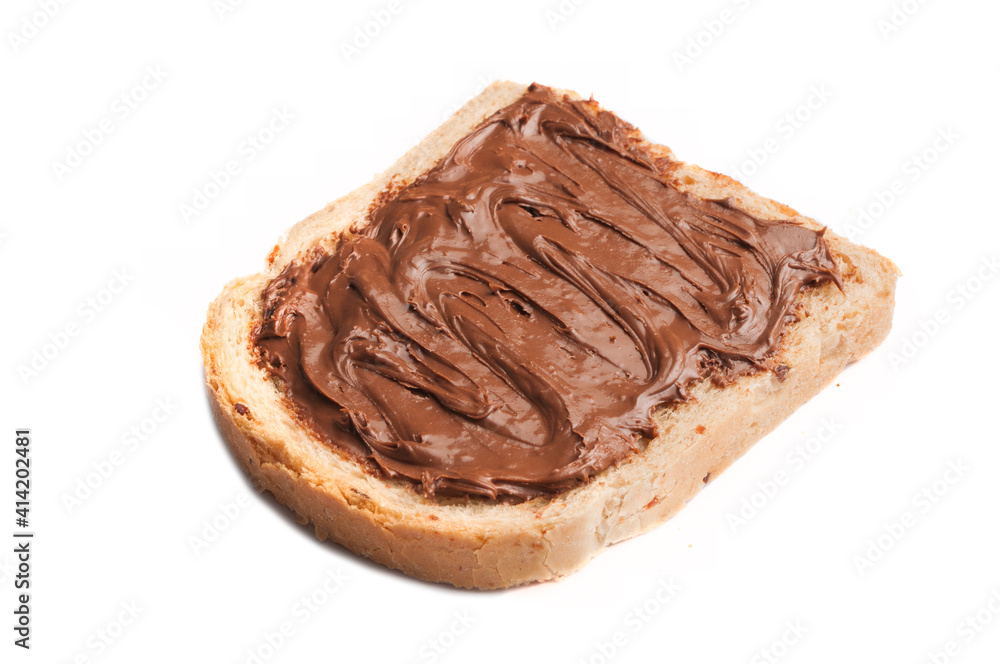 Slice of cereal bread with chocolate hazelnut cream spread isolated on white background Slice of cereal bread with chocolate hazelnut cream spread isolated on white background