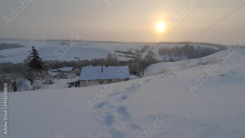 Winter mornjng over the village photo