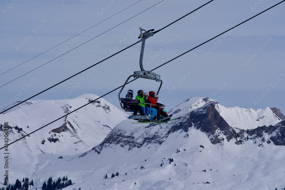 Chairlift at Swiss ski resort with pole. Photo taken at Hoch-Ybrig, Switzerland, February 15th, 2021.