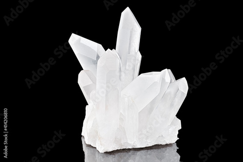 Amazing pure Quartz Crystal cluster gemstone closeup macro isolated on black background. Natural rare white mineral rough stone. Beautiful crystals arrangement